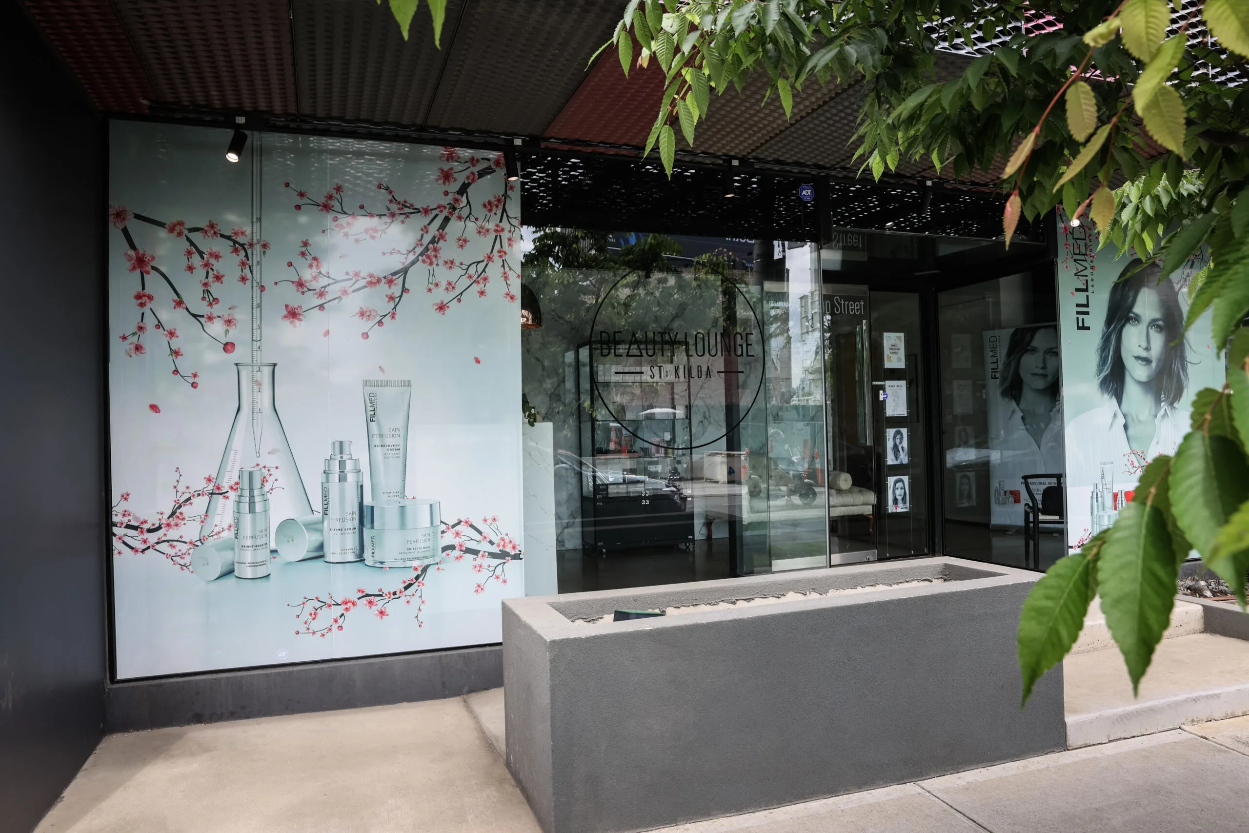 Beauty Lounge St Kilda marble-and-glass shopfront on the corner of Wellington Street and St Kilda Road